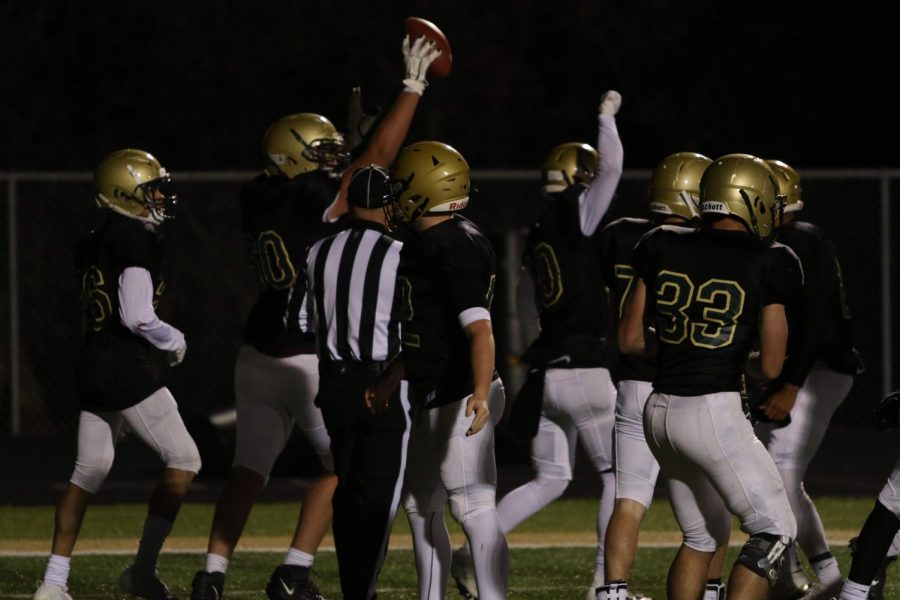 The offensive line celebrates with the rest of the team after a touchdown catch from Tate Crane '20.