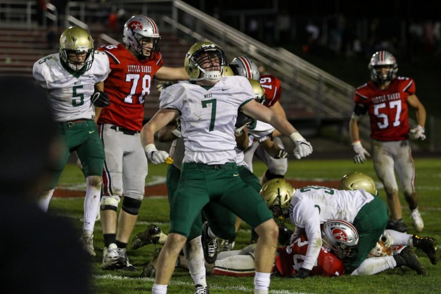 Senior linebacker Grant Henderson celebrates his tackle for loss late in the fourth quarter of the Battle for the Boot at Bates Field on Oct. 25.