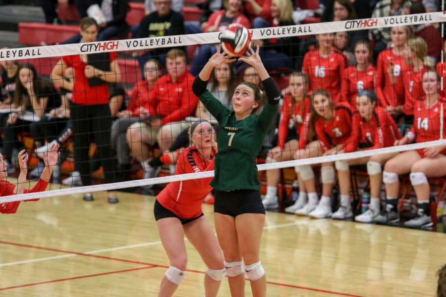 Emma Dunlap '22 sets the ball at the team's volleyball playoff match against City on Oct. 29. Dunlap finished with nine assists in the match.