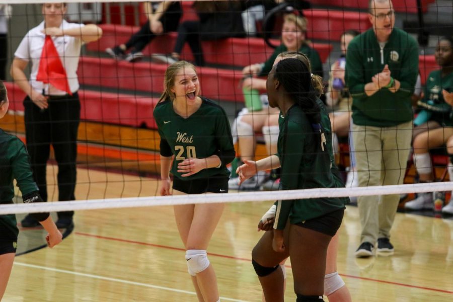 Ryann Culver '21 celebrates a point with her teammates at the team's volleyball playoff match against City on Oct. 29.