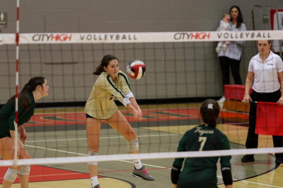 Sophomore libero Katherine Kouba digs a City High hit in the first set of the team's match against City High on Oct. 29.