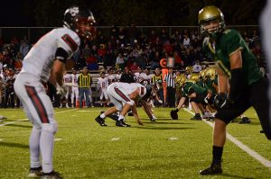 Tate Crane 20 lines up before the offense runs a play against Linn-Mar at the homecoming game at Trojan Field on Oct. 4.