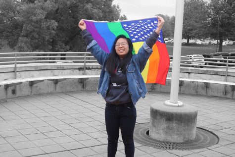 Michelle Kim 20 outside of West High showing her pride in her identity as a member of the LGBTQ+ community