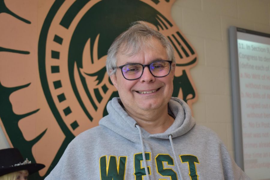 Although Gary Neuzil is a City High graduate, he shows his West High spirit in this photo.