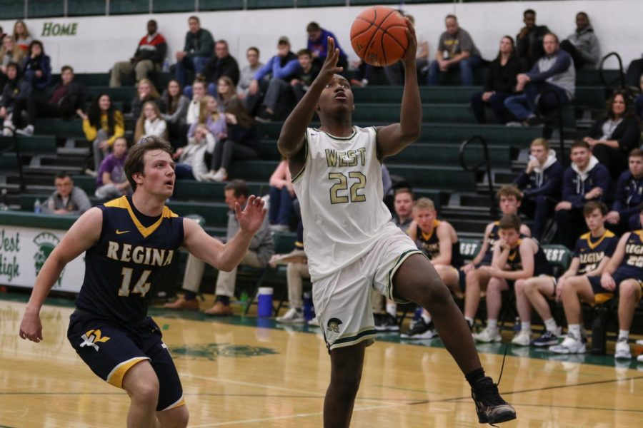 Mikey Brown '21 makes a layup during a scrimmage against Regina on Nov. 30. 