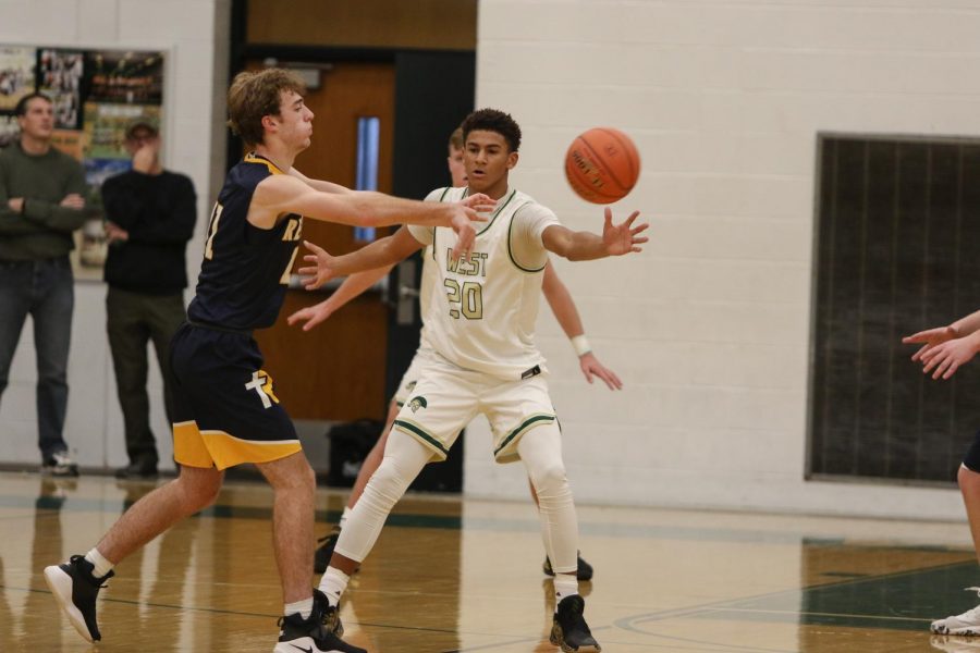 Marcus Morgan '20 reaches for a steal during a scrimmage against Regina on Nov. 30. 