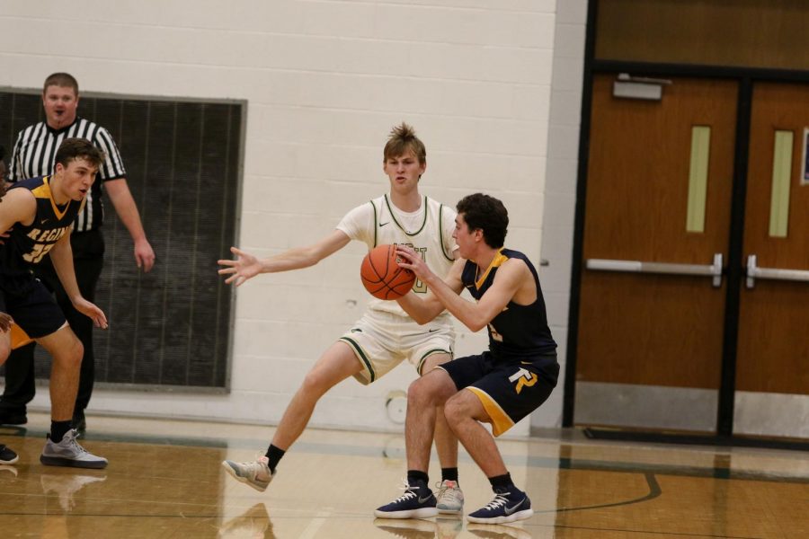 Andrew Tauchen '21 plays help defense during a scrimmage against Regina on Nov. 30. 