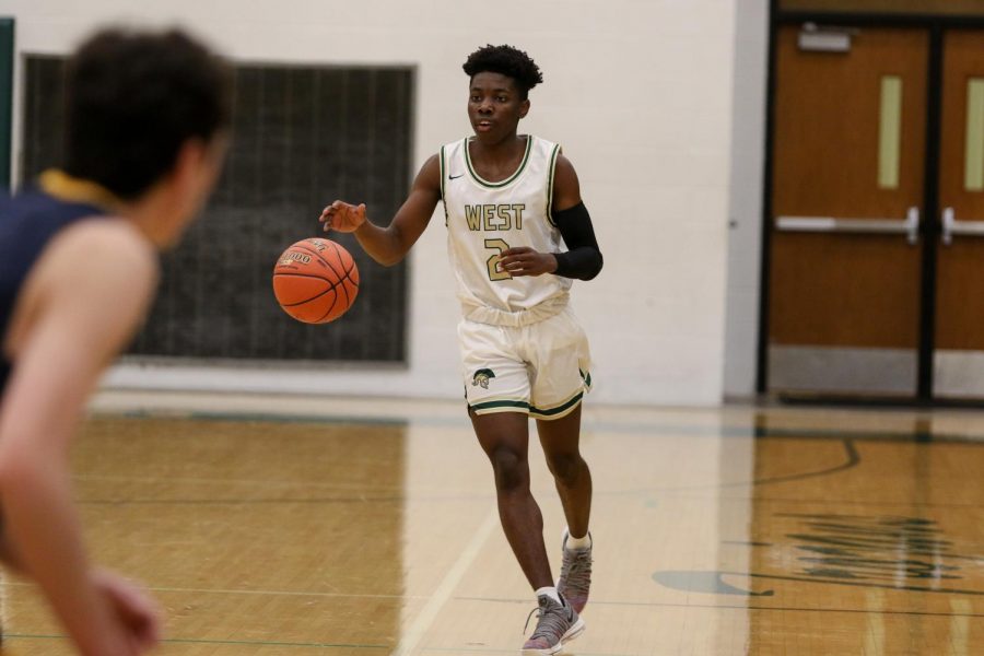 Christian Barnes '22 dribbles the ball down the court during a scrimmage against Regina on Nov. 30. 