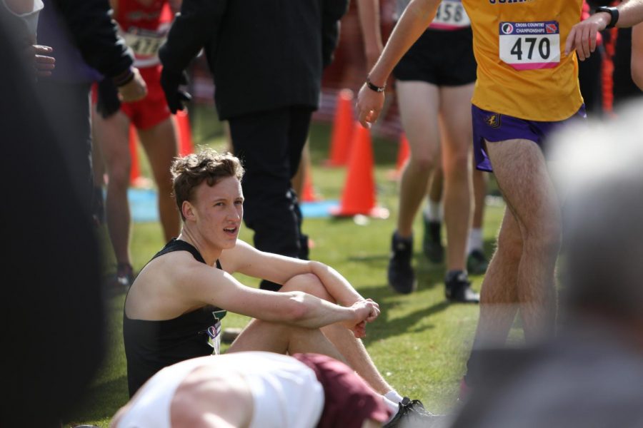 Ken Wilbur '20 rests after his final race for West at the state cross country meet on Nov. 2 in Fort Dodge.