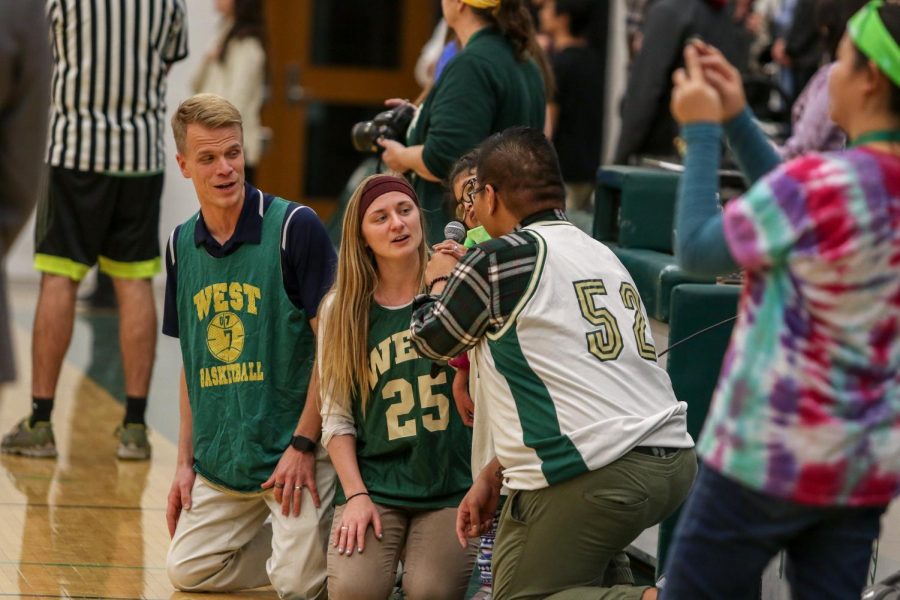 Pammie Quintero-Rodriguez '23, David Haas, Luigi Enriques, and Anna Englin perform the national anthem before the third annual Best Buddies and PALS basketball game against faculty on Nov. 7.