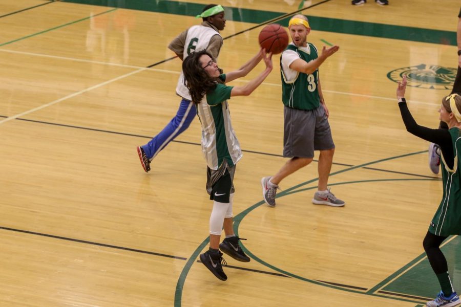 Alex Kimura '22 knocks down a shot during the third annual Best Buddies and PALS basketball game against faculty on Nov. 7.