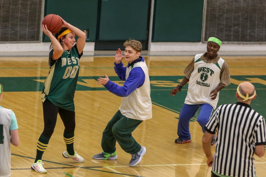 Lucas Locher '21 and Byamungu Omari '20 play defense at the third annual Best Buddies and PALS basketball game against faculty on Nov. 7.