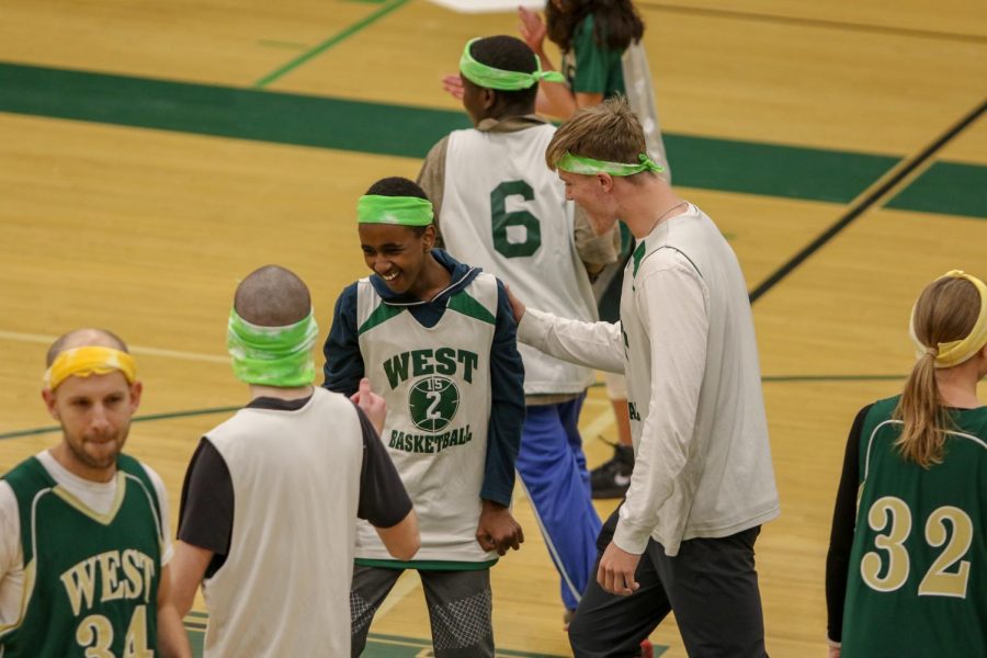 Basel Noureldin '23 celebrates after making a shot during the third annual Best Buddies and PALS basketball game against faculty on Nov. 7.