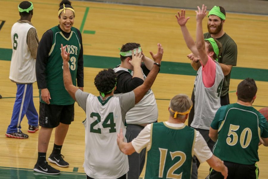 Chase Lonngren '20 and teammates celebrate a point during the third annual Best Buddies and PALS basketball game against faculty on Nov. 7.