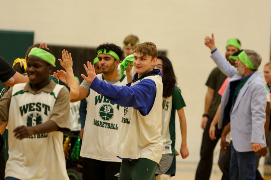 Lucas Locher '21 shakes the the other team's hand after the third annual Best Buddies and PALS basketball game against faculty on Nov. 7.