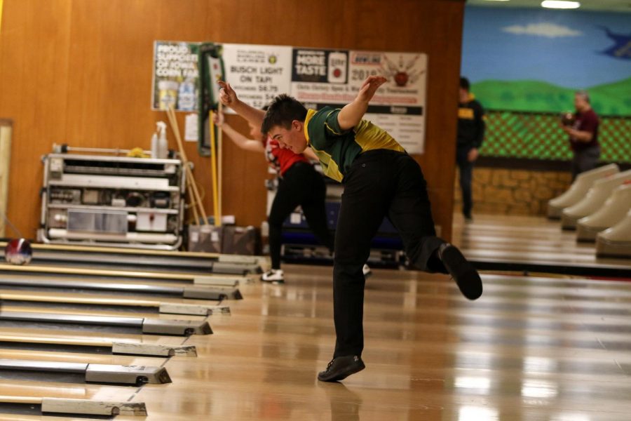 Cameron McKnight '21 holds his form as he eyes his bowl on Nov. 26 at Colonial Lanes against City High.