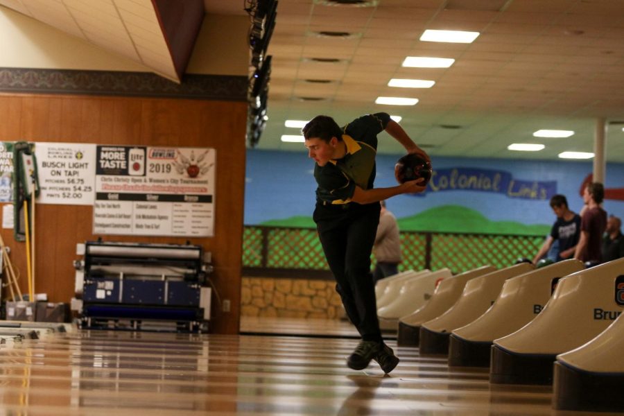 Ryan Bys '22 stares down the ally as he prepares to bowl on Nov. 26 at Colonial Lanes against City High.