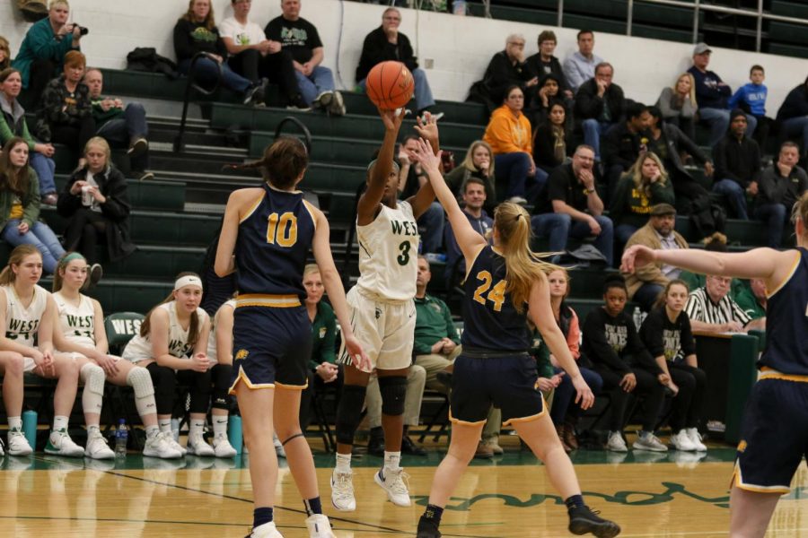 Matayia Tellis '21 knocks down a three-pointer against Cascade on Nov. 22.