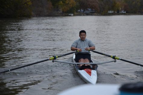 Jim Li 21 rows hard on a cold day in a race between him, the team boats and the doubles.