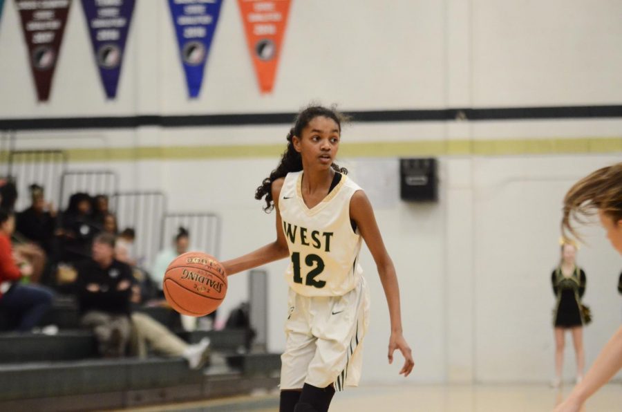 Meena Tate '23 looks for a teammate ito pass to on Dec. 20. 