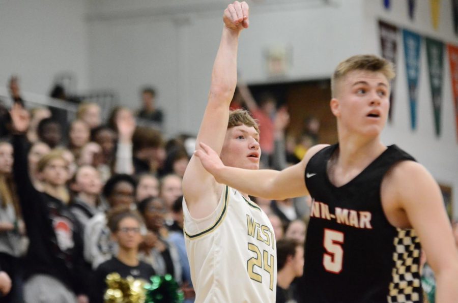 Ben VanderLeest '20 holds his follow through after taking a shot against Linn-Mar on Dec. 20. 