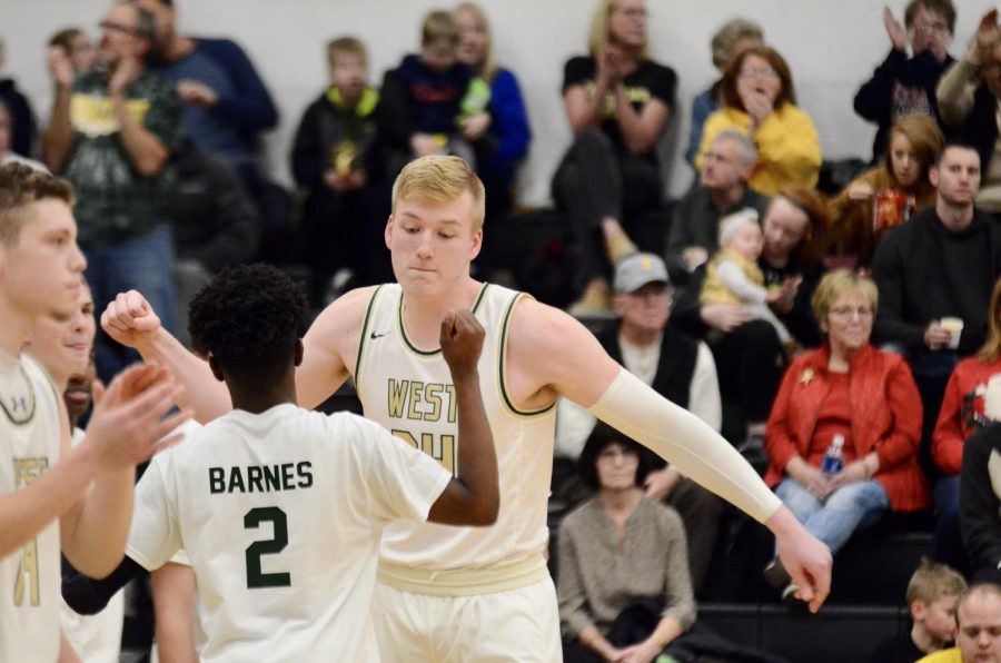 Even Brauns '20 is introduced during starting lineups against Linn-Mar on Dec. 20.