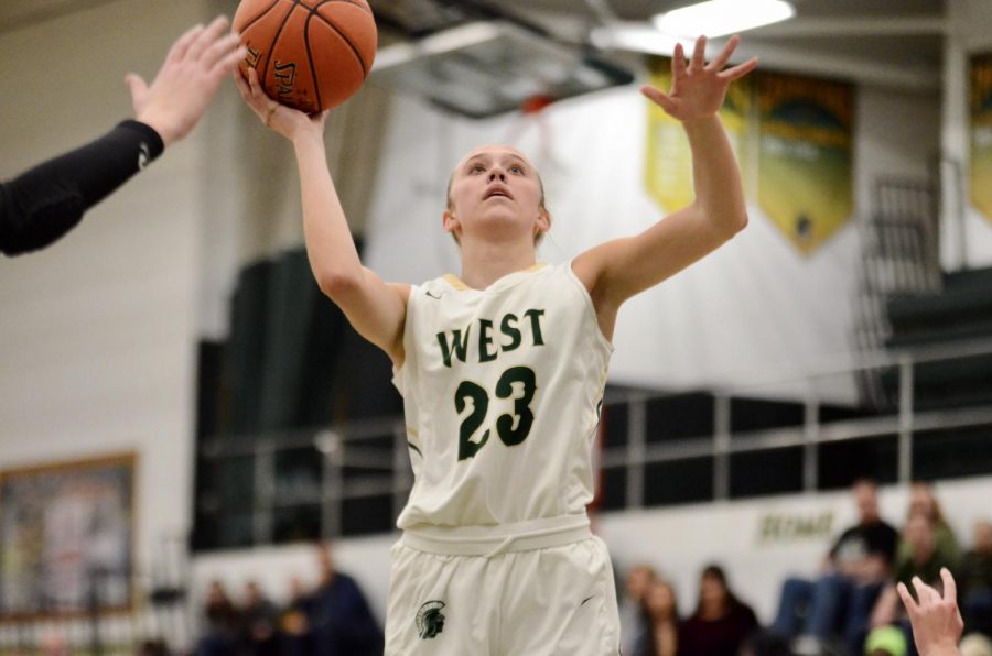 Audrey Koch '21 takes a shot off of a rebound on Dec. 20 against Linn-Mar. 