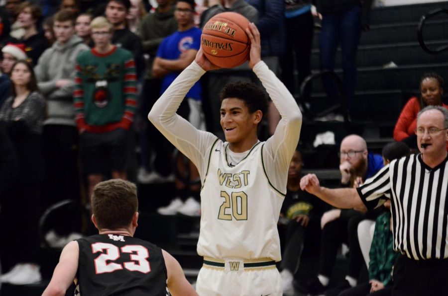 Marcus Morgan '21 smiles as the end of the fourth quarter nears with West in the lead on Dec. 20 against Linn-Mar. 