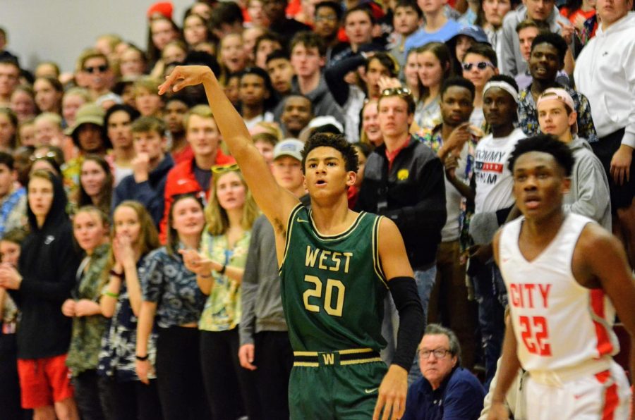 Marcus Morgan '21 knocks down a three-pointer against City on Dec. 14.