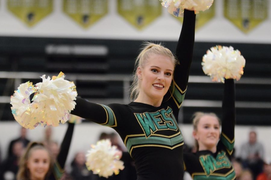 Chloe Gretter '20 strikes a pose during West High Poms half time performance on Dec. 20. 