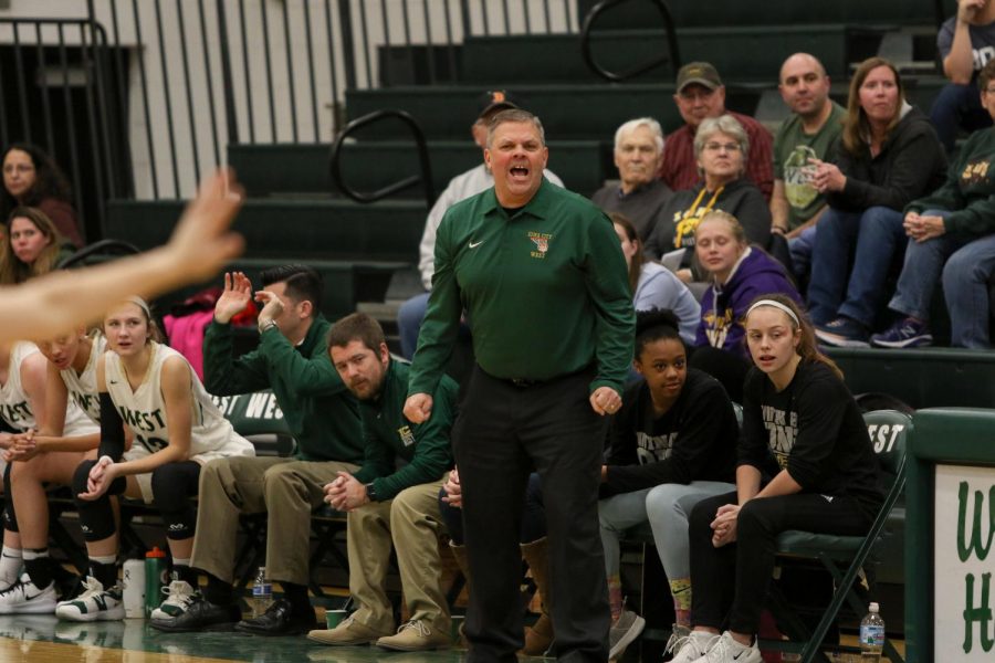 Head coach Bj Mayer calls out a press against Western Dubuque.