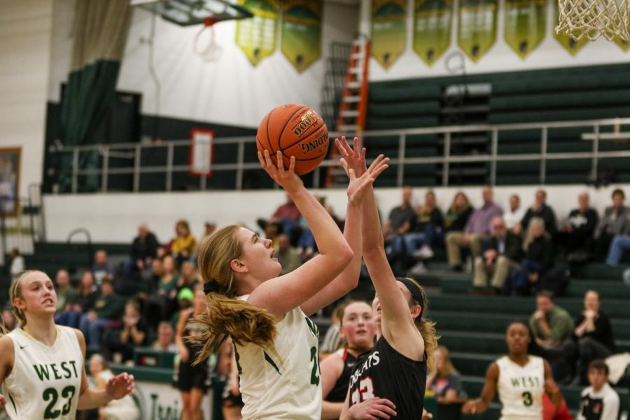 Anna Prouty '23 goes up for a layup against Western Dubuque.