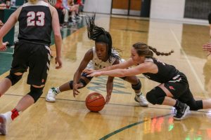 Matayia Tellis 21 fights for a loose ball against Western Dubuque.