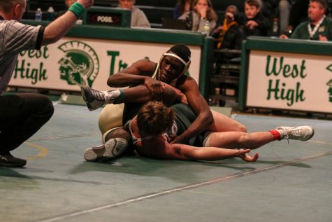 Newcomer Anu Dokun 20 fights for position during his 195 pound match against Adam Ward 21. Dokun fought back from a 7-3 deficit to force an extra period, but ultimately fell 11-9. Dokun transferred to West from Memphis for the beginning of his senior year.