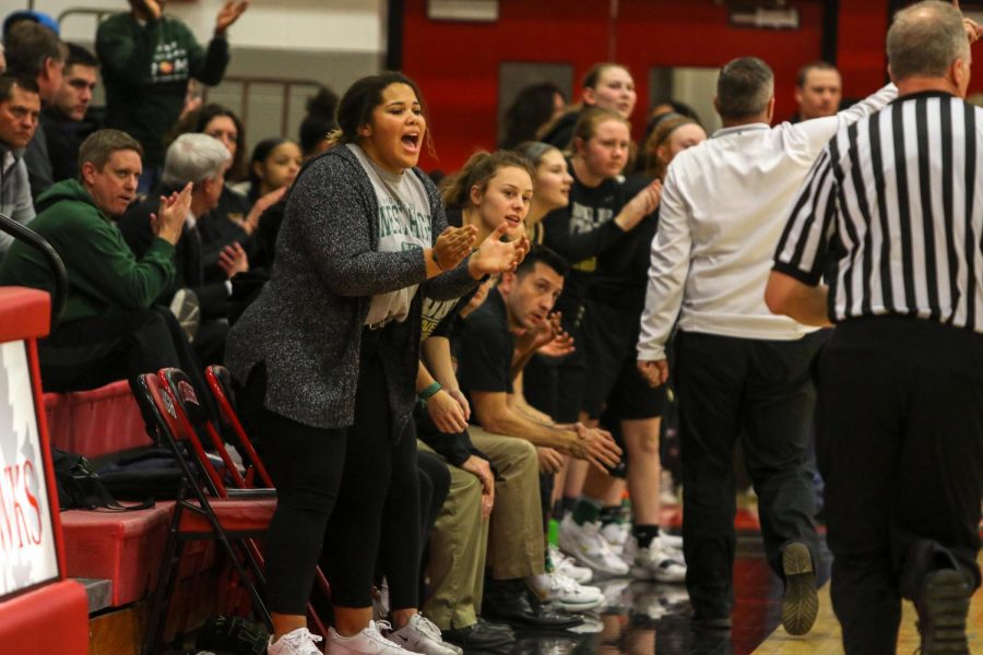 Phoebe Burt '21 celebrates a basket against City on Dec. 14