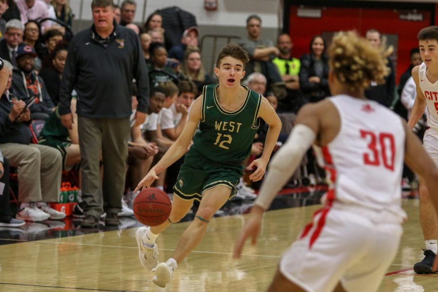 Joe Goodman pushes the ball up the court on a fast break against City on Dec. 14.