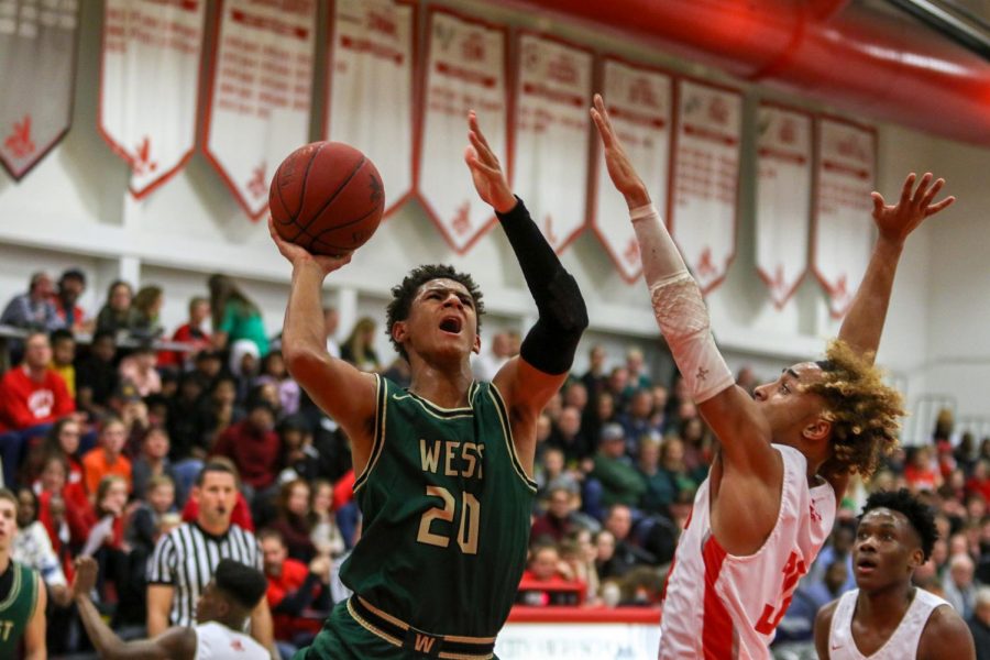 Marcus Morgan '21 goes up for a layup against City on Dec. 14. 