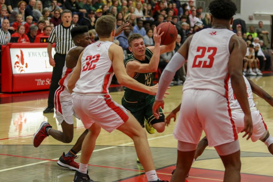 Nick Pepin '20 drives into a group of City High defenders on Dec. 20. 