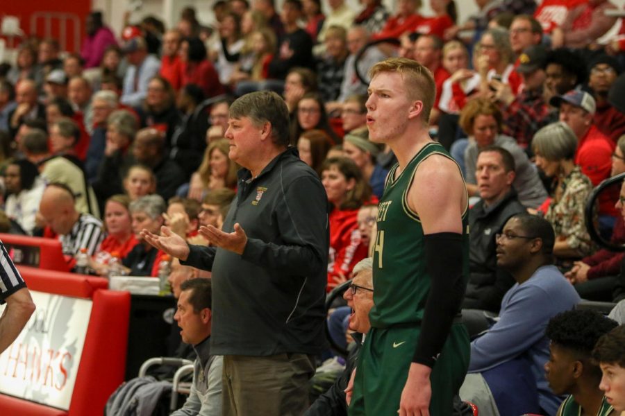 Steve Bergman and Even Brauns '20 question a call on the bench against City on Dec. 14.