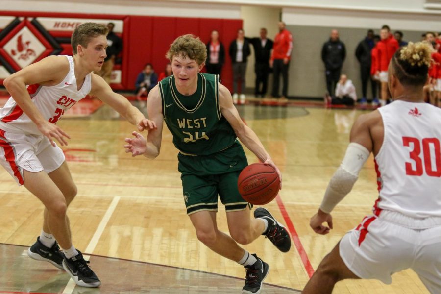 Ben Vander Leest '20 drives to the hoop during the second half against City on Dec. 14.