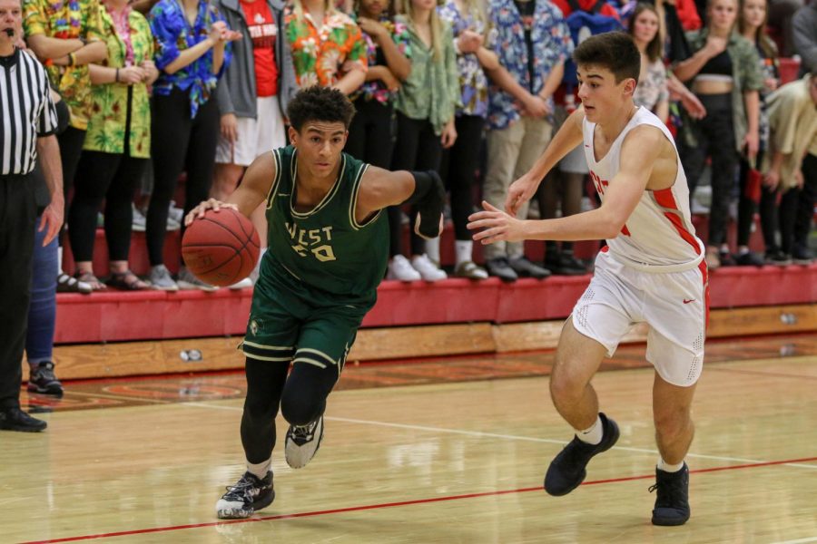 Marcus Morgan '21 breaks for the hoop against City on Dec. 14.