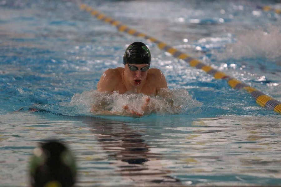 Jordan Christensen '22 swims during a dual swim meet against Linn-Mar on Dec. 17.