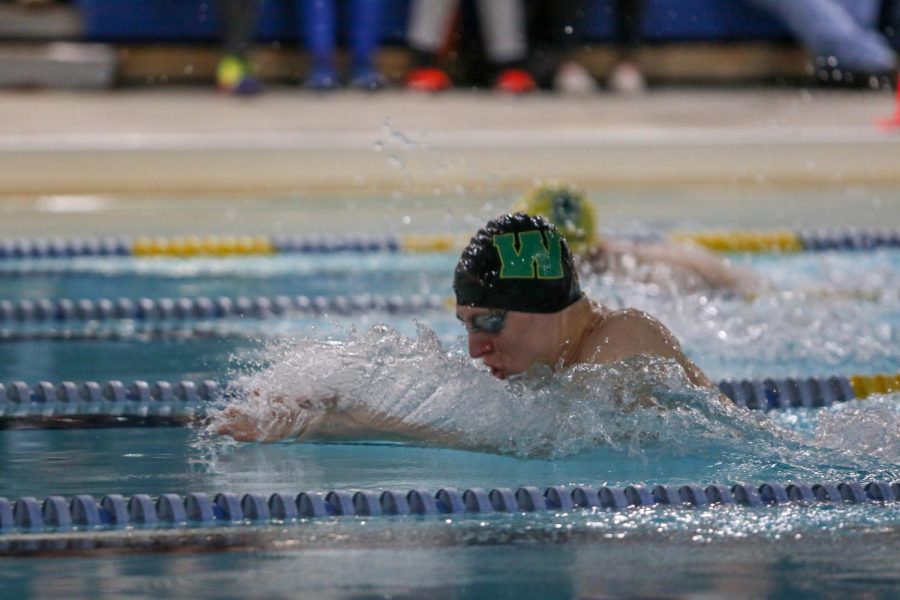 Jordan Christensen '22 swims in the 100-yard breaststroke during a dual swim meet against Linn-Mar on Dec. 17.