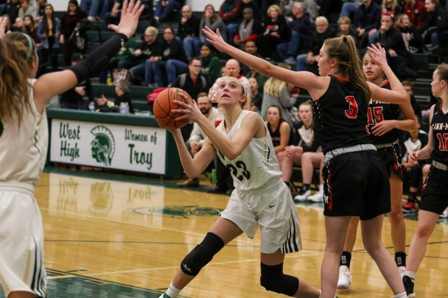 Audrey Koch '21 looks to score under the hoop against Linn-Mar on Dec. 20.