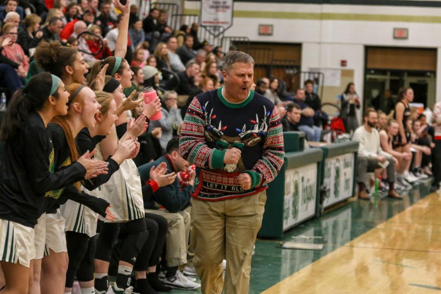 Head coach Bj Mayer celebrates a Cora Saunders '20 three against Linn-Mar on Dec. 20.