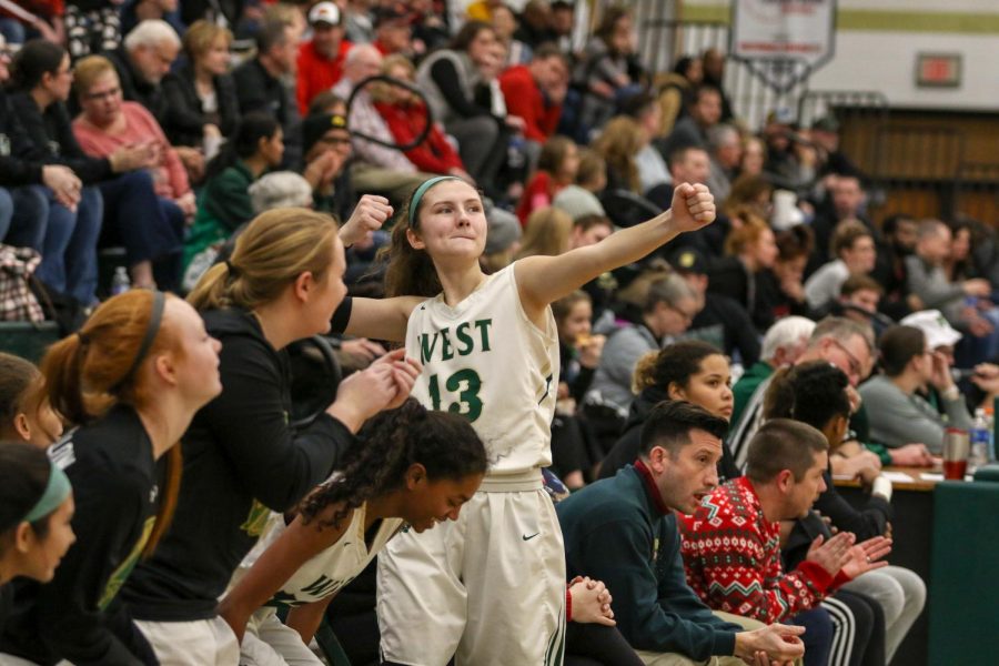 Grace Schneider '20 celebrates a three pointer against Linn-Mar on Dec. 20.