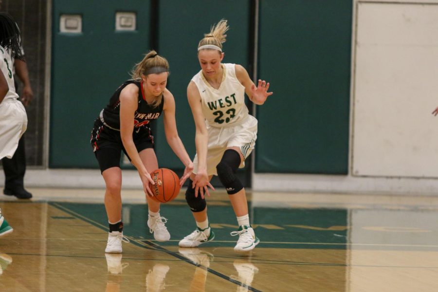 Audrey Koch '21 reaches for a steal against Linn-Mar on Dec. 20.