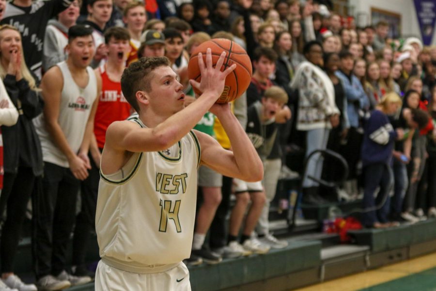 Nick Pepin '20 lines up a three against Linn-Mar on Dec. 20.