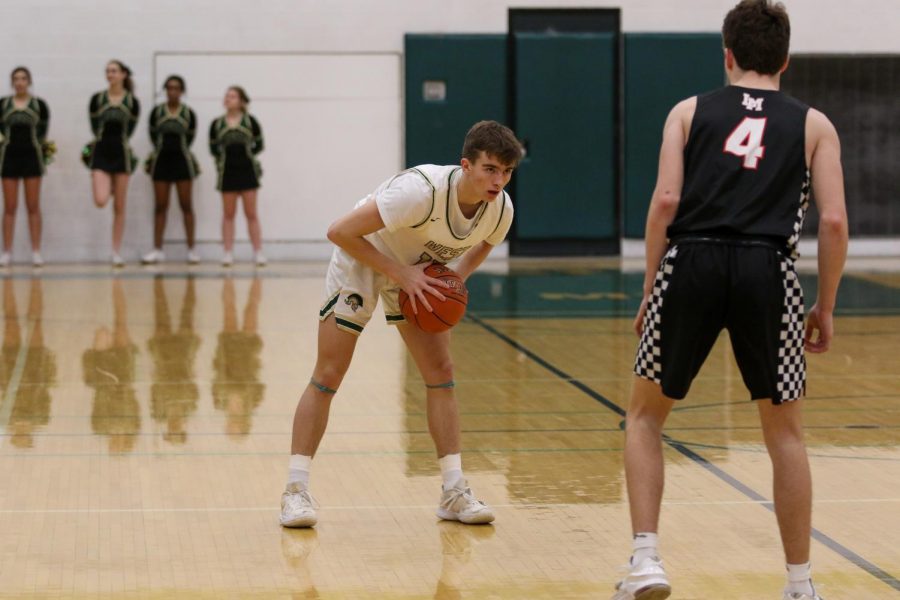 Joe Goodman '20 evaluates the defense against Linn-Mar on Dec. 20.