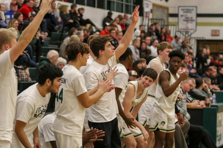 Grahm Goering '21 and his teammates celebrate a Nick Pepin '20 three against Linn-Mar on Dec. 20.